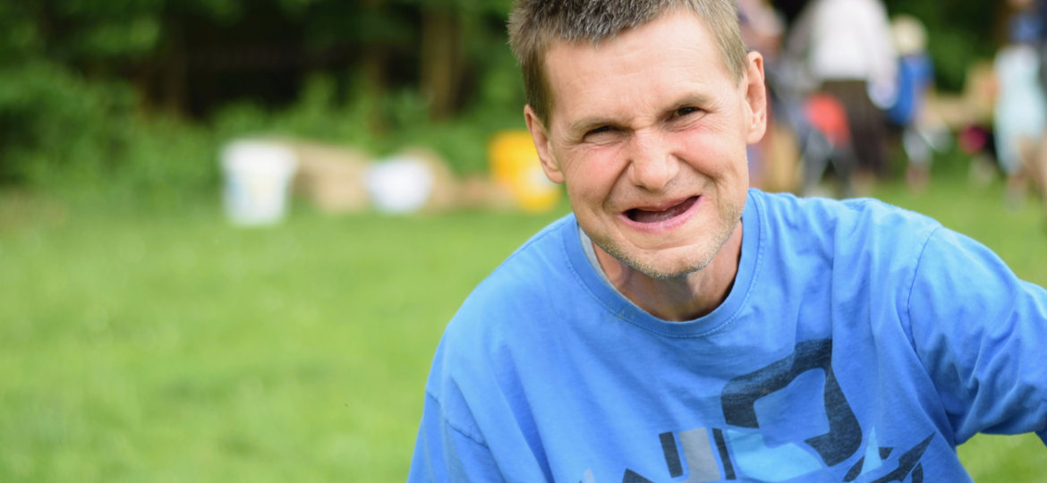 Portrait of happy smiling handicaped man.